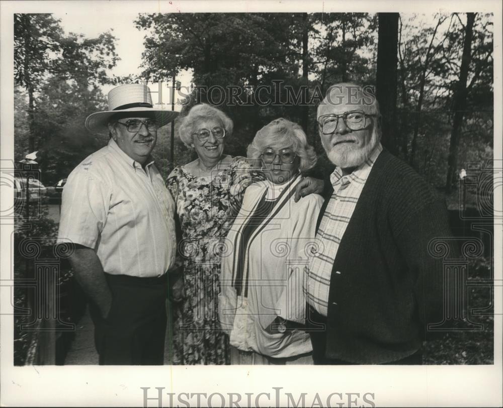 1989 Press Photo Group of friends pose together with an author - abna18751 - Historic Images