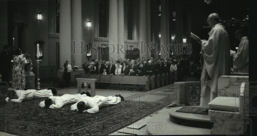 1994 Press Photo Roman Catholic priests lie prostrate at St. John Cathedral mass - Historic Images