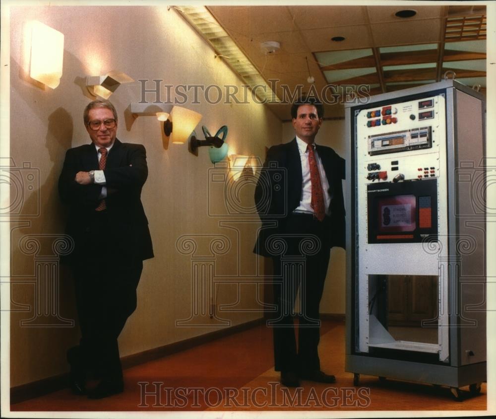 1994 Press Photo Executives, Standard Electric Supply Company, next to products - Historic Images