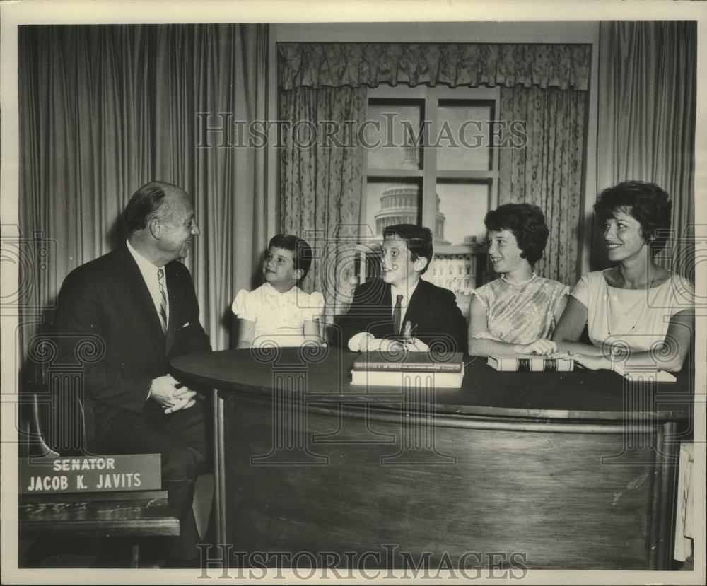 Press Photo Senator Jacob Javits and family on TV program answering questions. - Historic Images