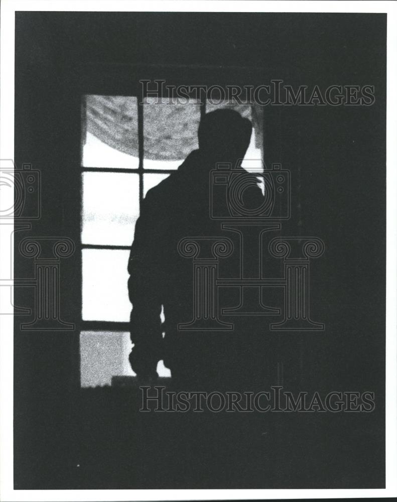 1989 Press Photo Silhouette of unknown person in window - abna19847 - Historic Images