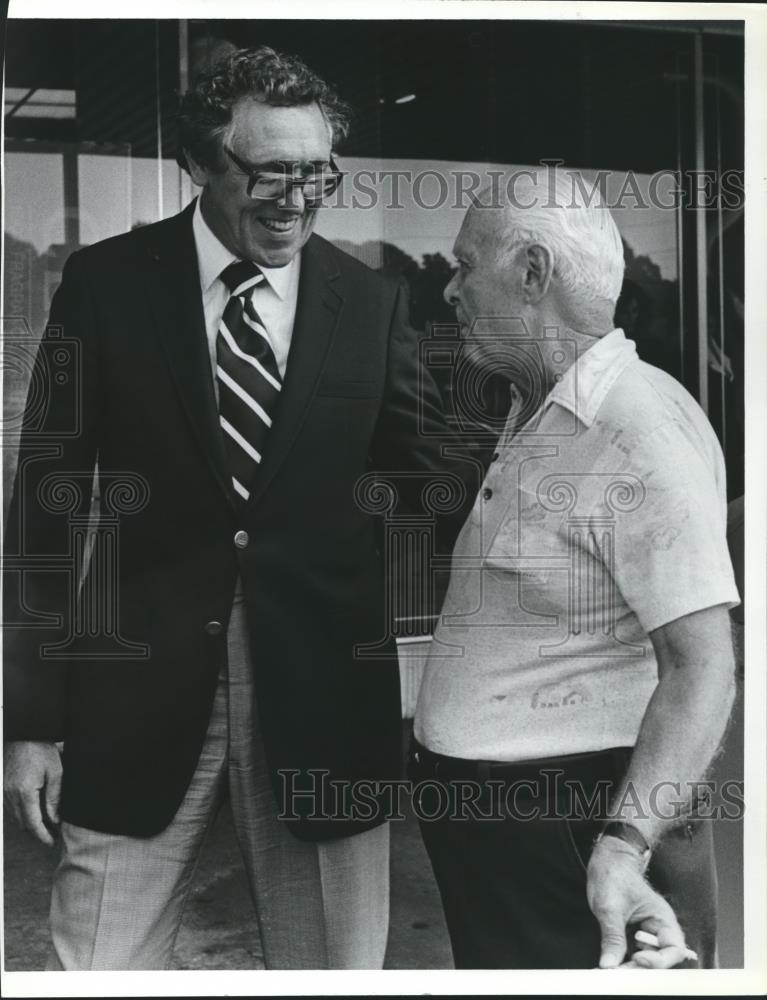 1980 Press Photo John Buchanan and man stand in front of store - abna22091 - Historic Images