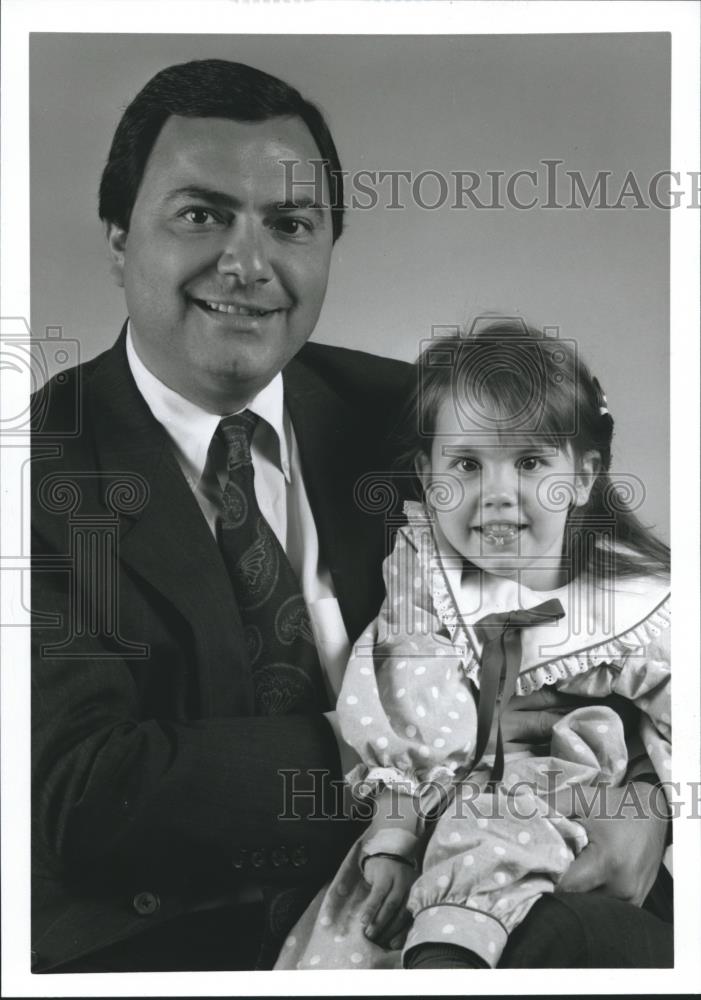Press Photo Ronald Bruno with young girl - abna22335 - Historic Images