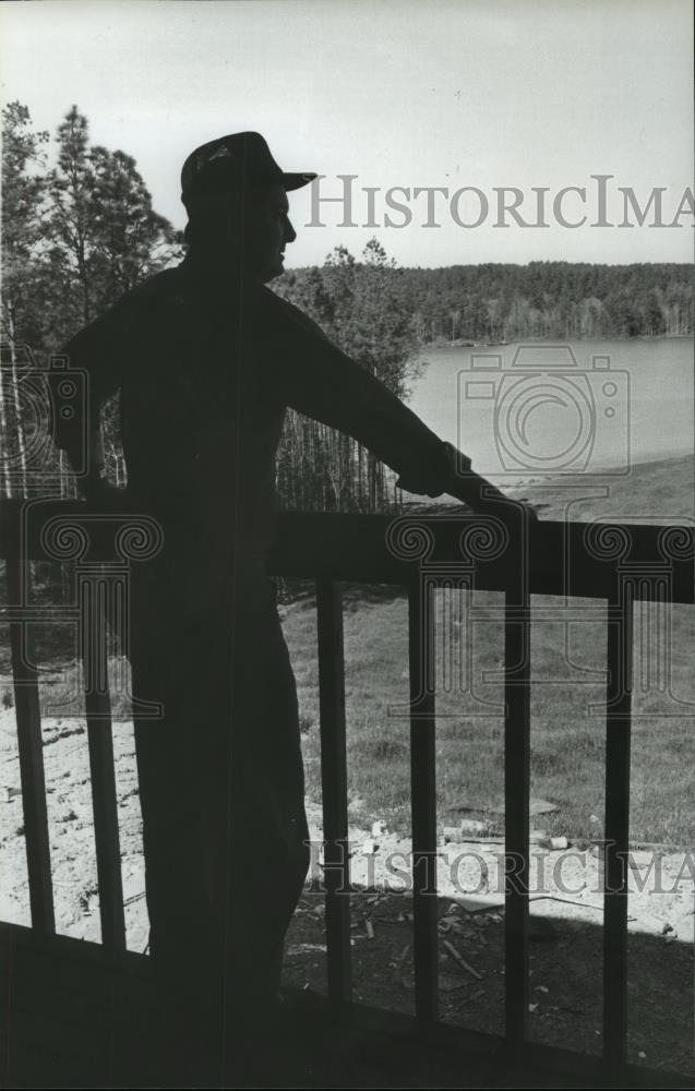 1980 Press Photo Man Silhouetted on Porch Overlooking River - abna24236 - Historic Images