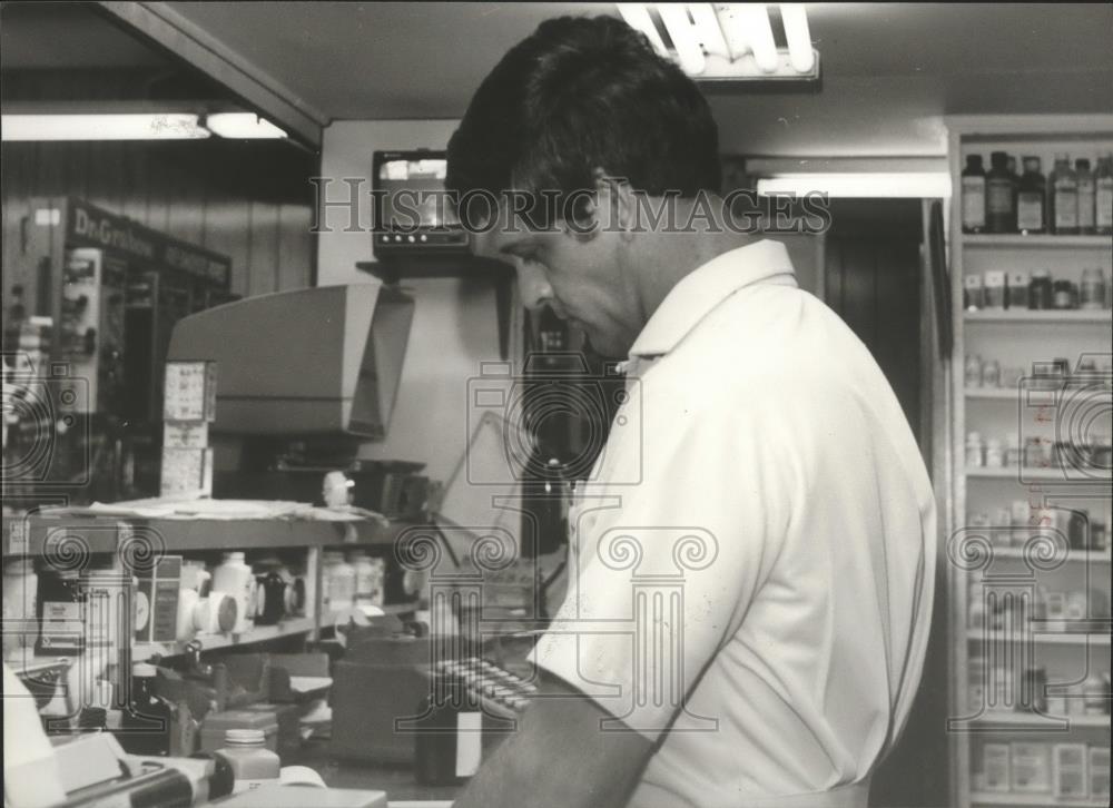 1979 Press Photo Morrison, seen inside his drugstore in Ensley, Alabama - Historic Images