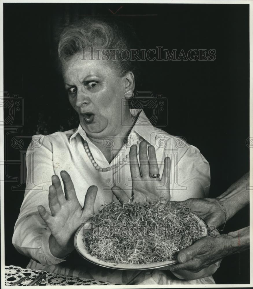 1989 Press Photo Dolores P. Spangler Pushing Away a Plate of Alfalfa Sprouts - Historic Images