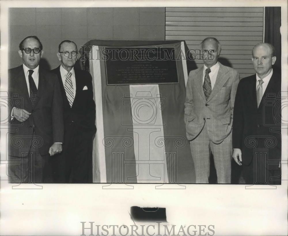 Press Photo Group of Men Poses around Plaque - abna37381 - Historic Images