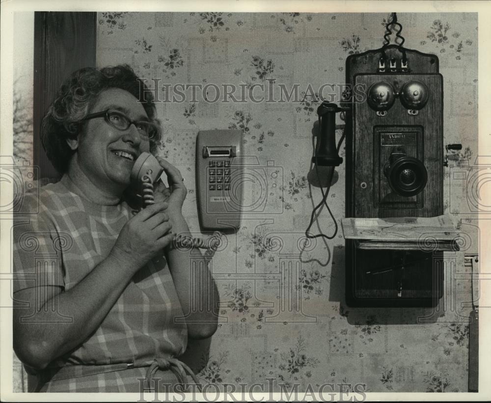 Press Photo Woman using push button wall telephone - mjc07033 - Historic Images