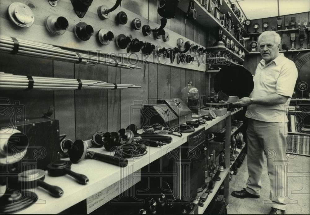 1983 Press Photo Man Handles Telephone Items - mjc07187 - Historic Images