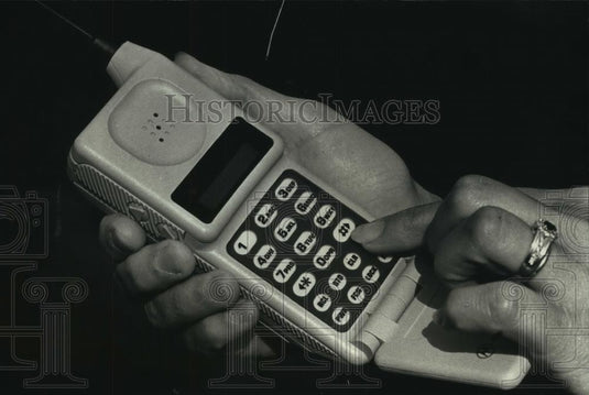 1990 Press Photo Person Dials Number on Microtac Personal Telephone - mjc07190 - Historic Images