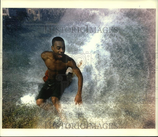 1993 Press Photo A youth plays in fire hydrant spray in Wisconsin - mjc08075 - Historic Images