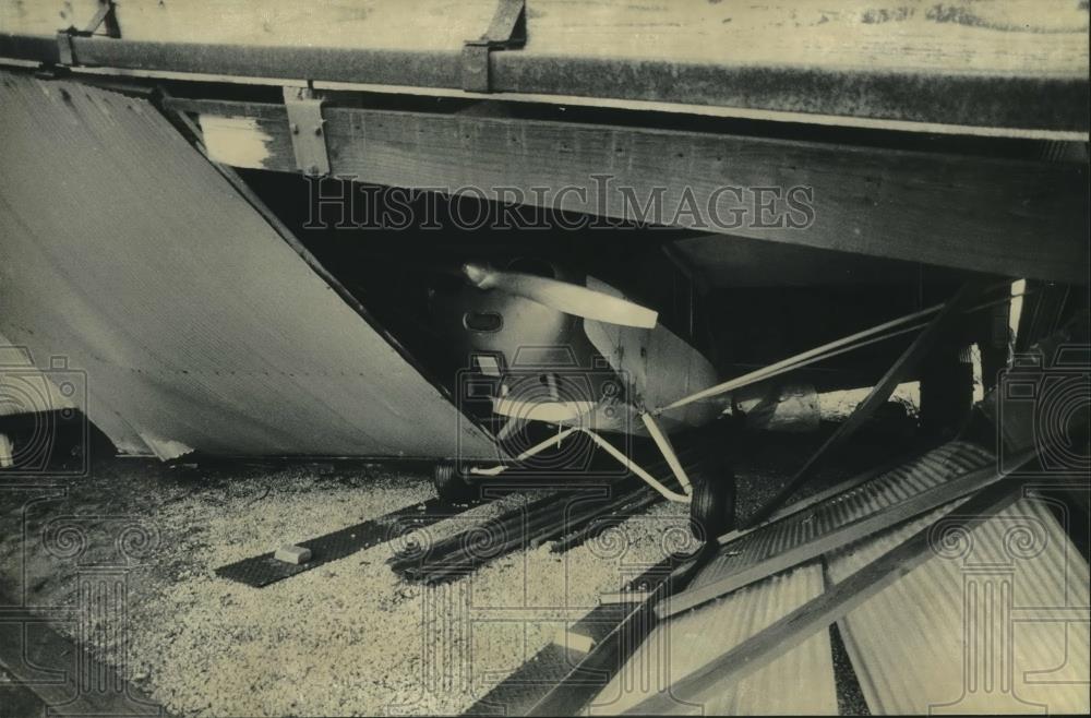 1983 Press Photo Plane under rubble after storm at Capital Airport in Wisconsin - Historic Images