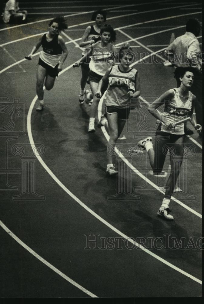 1991 Press Photo Two-mile relay runners at indoor meet at Waukesha South High - Historic Images