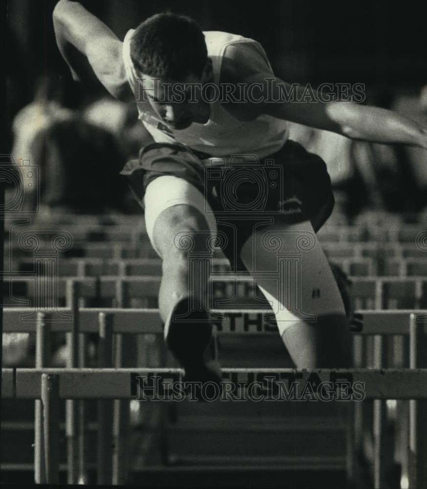 1991 Press Photo Greg Hall leaps hurdle in 330 high hurdles, Waukesha, Wisconsin - Historic Images