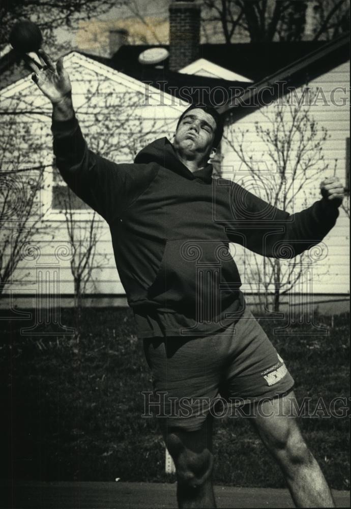 1992 Press Photo Mark Dahms works on shot put practice at Catholic Memorial High - Historic Images