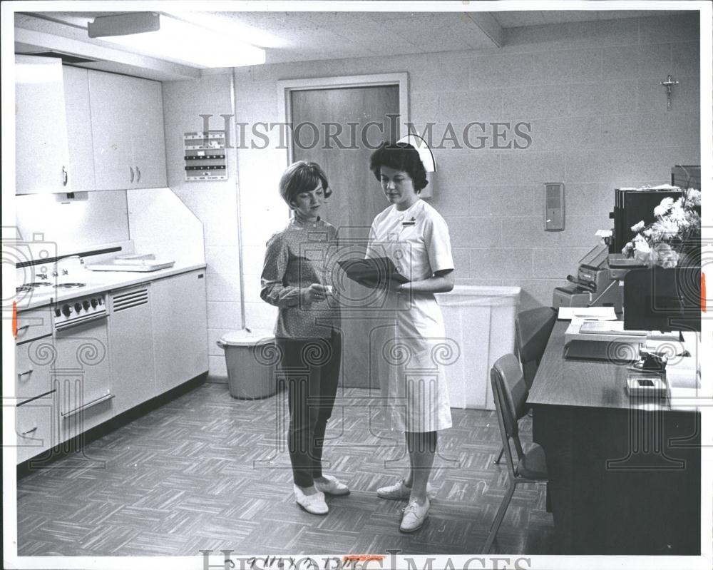 1965 Press Photo Nurse and patient review test &amp; exams - RRV36517 - Historic Images