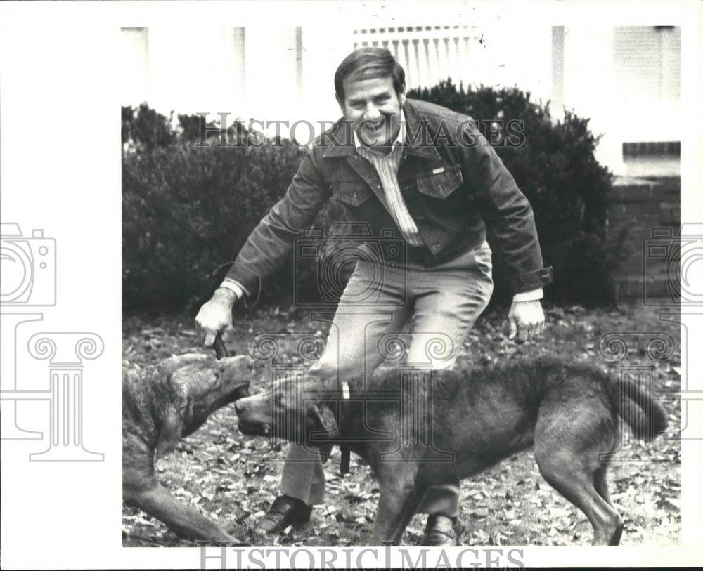 Press Photo Fob James, Governor of Alabama, Playing with Dogs - abna33938 - Historic Images