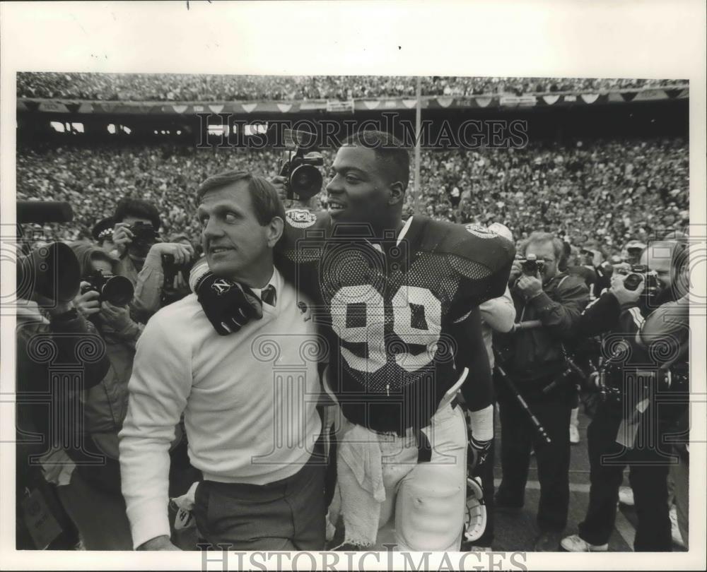 1986 Press Photo Football Player with Coach after Cotton Bowl Game - abns05684 - Historic Images