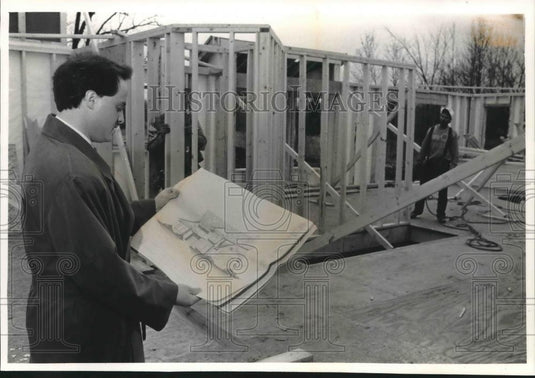 1993 Press Photo Man viewing plans of a home under construction - mjb63248 - Historic Images