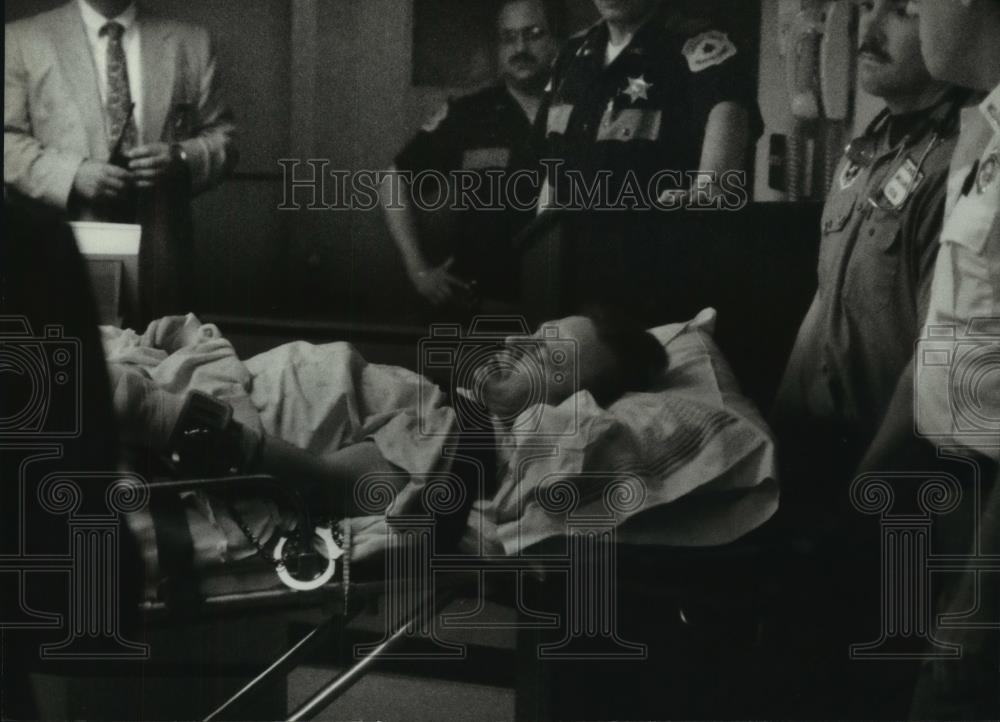 1994 Press Photo James Oswald, strapped to stretcher, taken to court, Waukesha - Historic Images