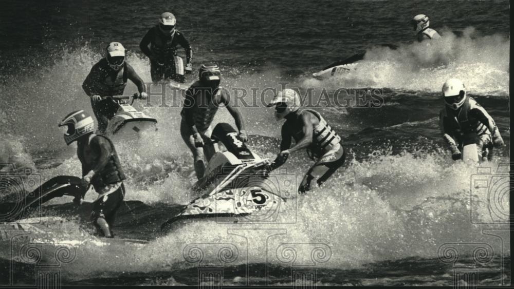 1990 Press Photo Jet Ski riders race through a course in Lake Michigan harbor - Historic Images