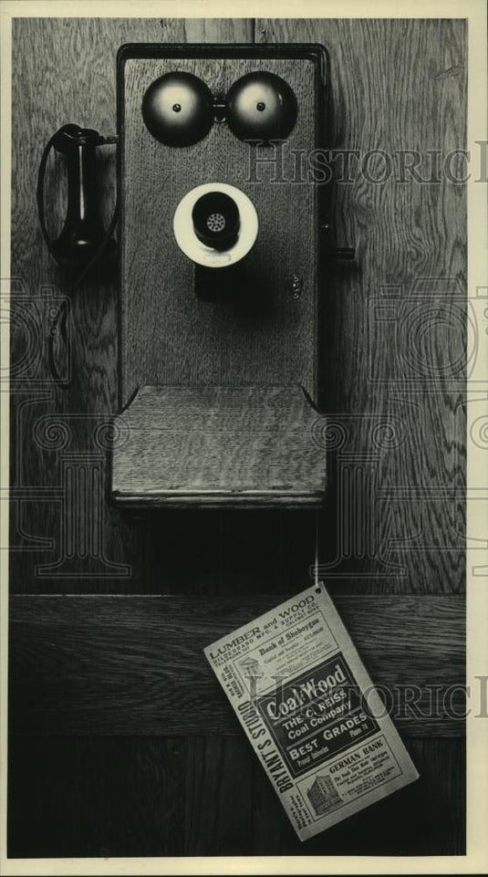 1983 Press Photo Old-fashioned telephone with phonebook - mjc06452 - Historic Images
