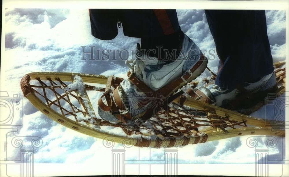 1994 Press Photo Person walking in wooden snow shoes - mjc13467 - Historic Images