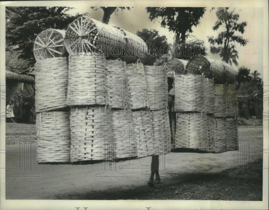 1982 Press Photo Baskets all but hide merchant in Bangkok, Thailand - mjc14857 - Historic Images