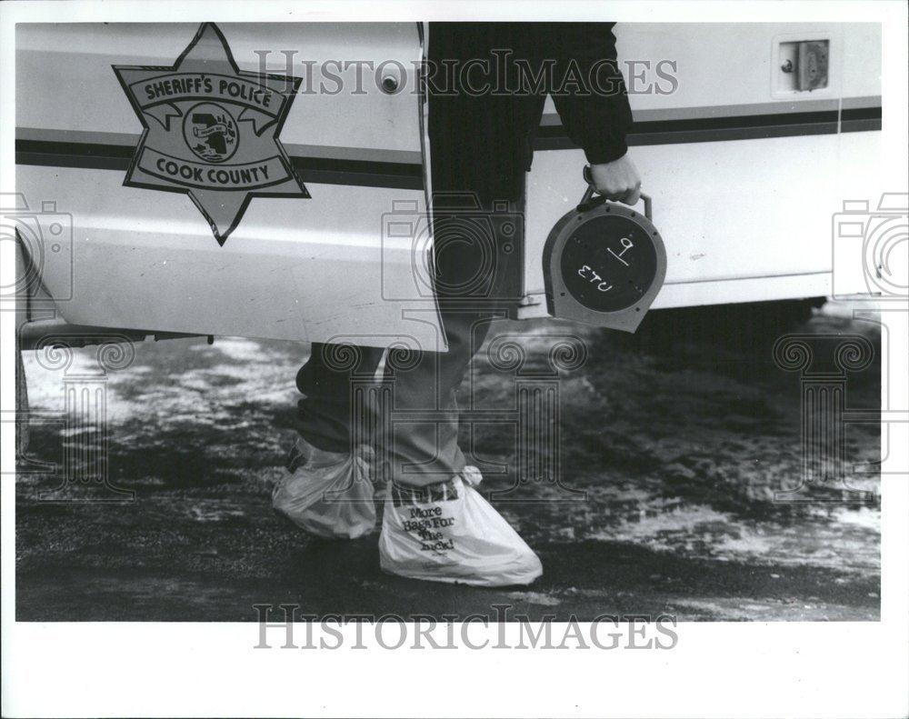 1993 Press Photo Officers Plastic Bag Boots Brown&#39;s - RRV43839 - Historic Images