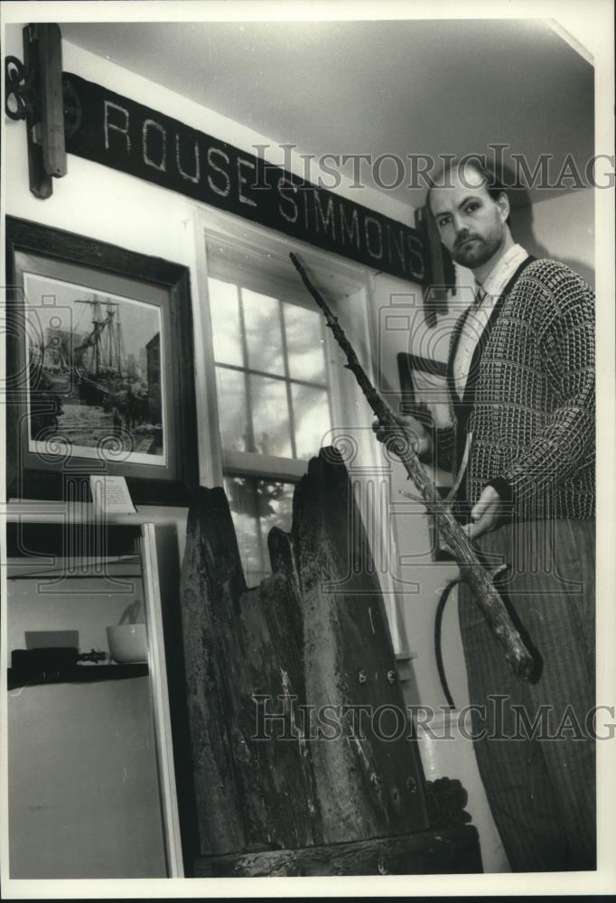 1989 Press Photo Dan Hildebrand Holding an Artifact from the Rouse Simmons - Historic Images