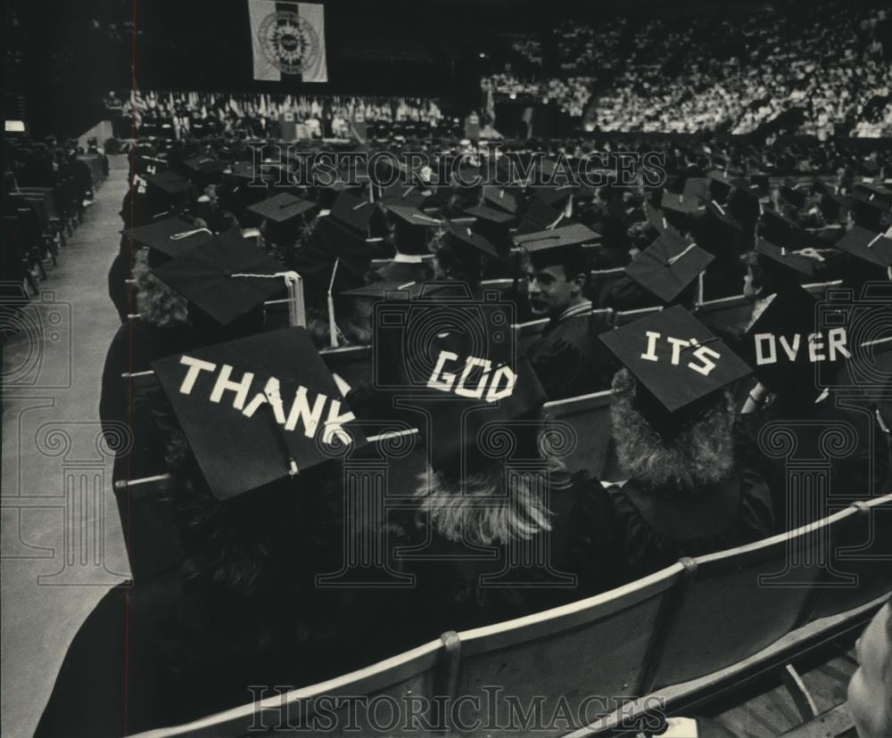 1987 Press Photo A message of four graduates at UWM ceremony with other students - Historic Images