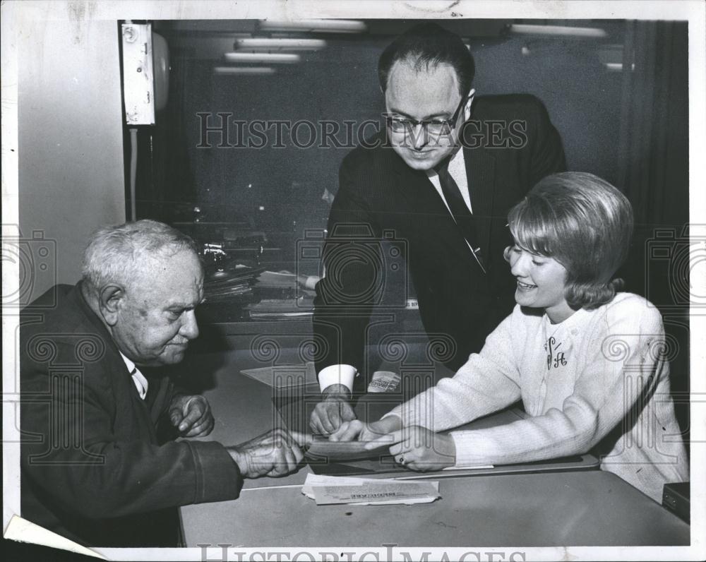 1966 Press Photo Man gets his Medicare Card, Detroit - RRV39327 - Historic Images