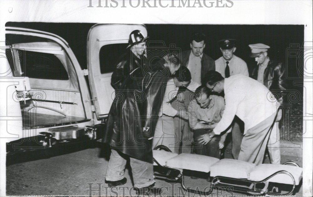 1954 Press Photo Safety Forces Help Injured Man - RRV45511 - Historic Images