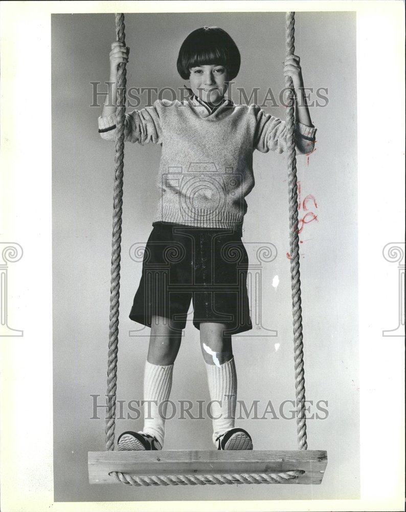 1984 Press Photo Lands End Kid On Wooden Swing - RRV56777 - Historic Images