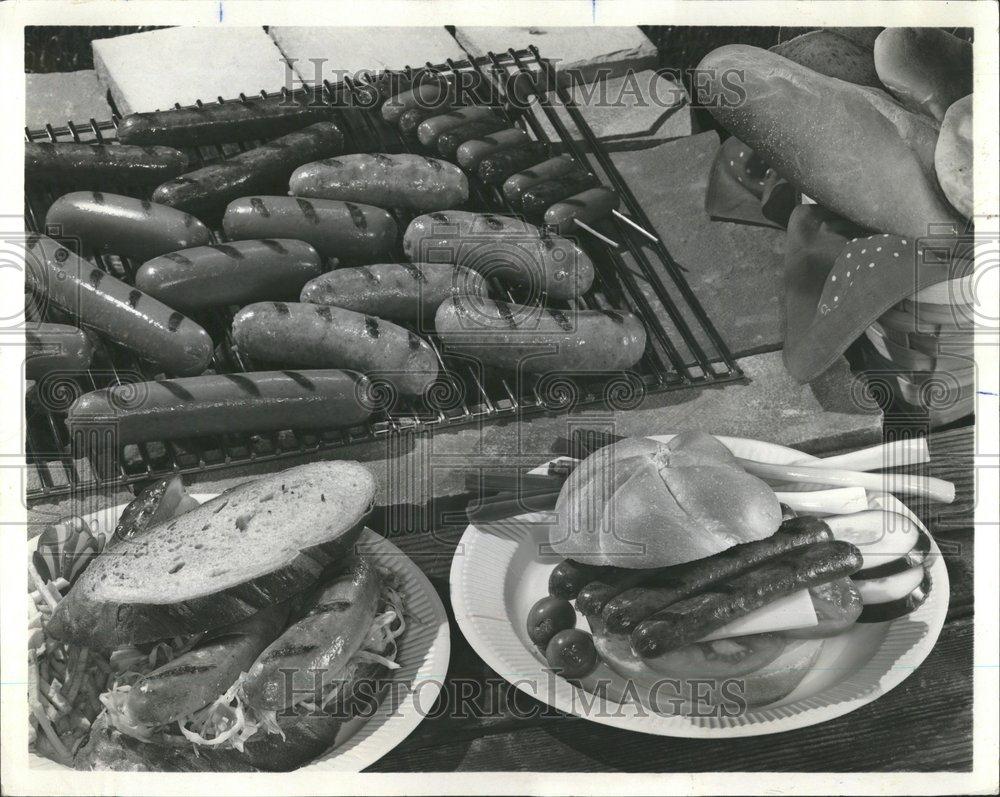 1969 Press Photo Sandwich Sausages Family Cook Grill - RRV59379 - Historic Images