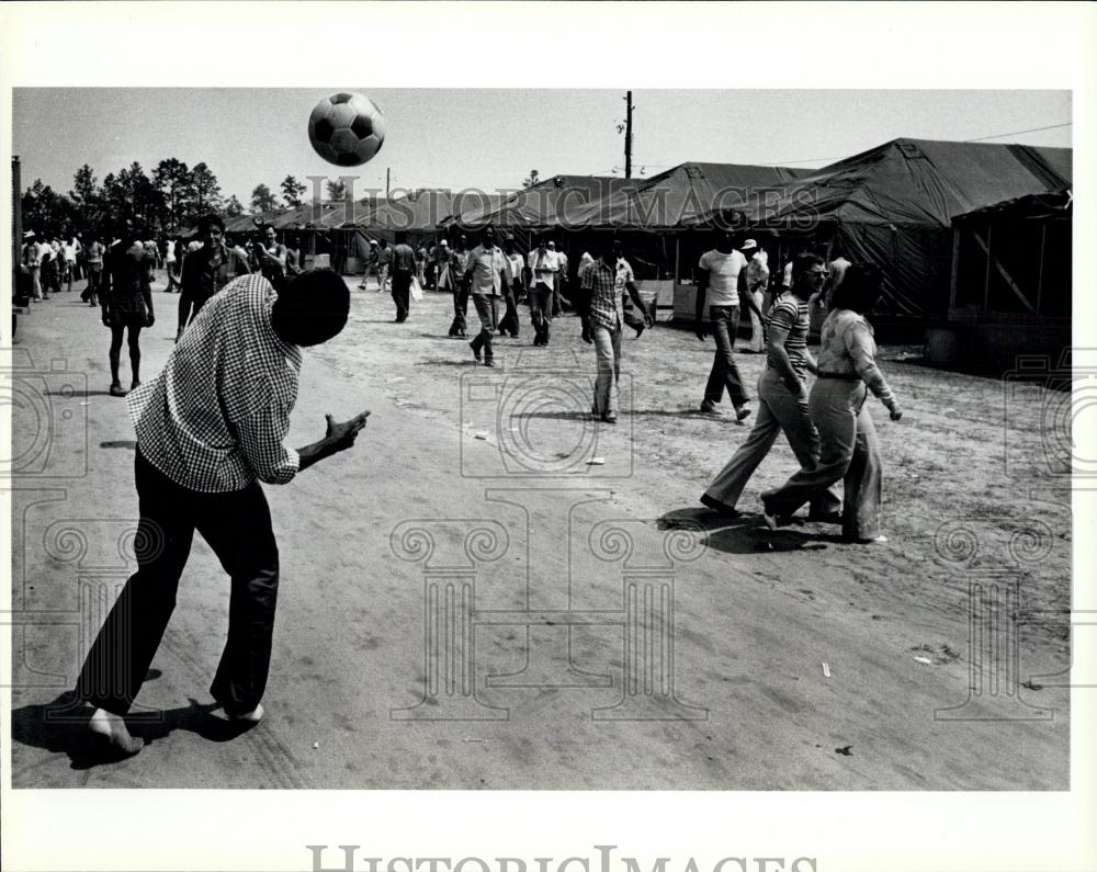 Press Photo Cuban Refugee pass the time by playing soccer - Historic Images