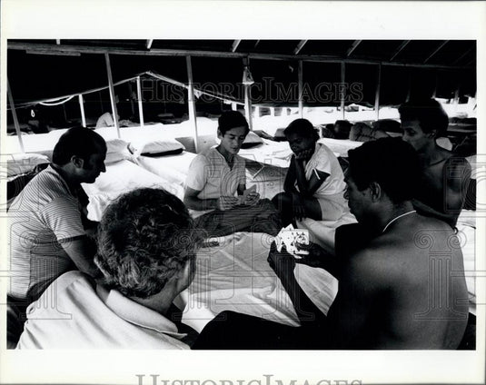 Press Photo Cuban refugees pass the time playing cards - Historic Images