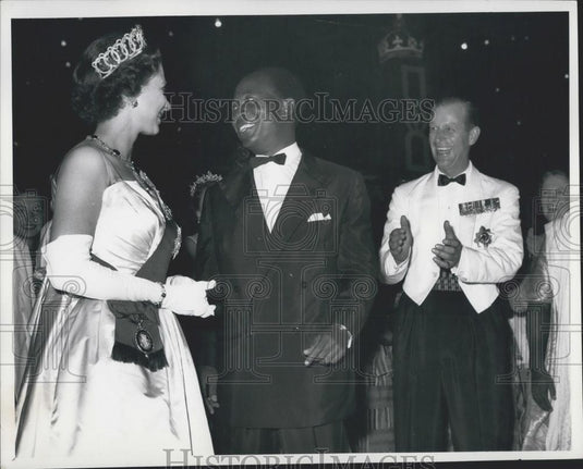 1961 Press Photo The Duke looks on laughing as Nkrumah asks the Queen to Dance. - Historic Images