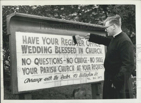 1959 Press Photo Reverend Christopher Wansey Rector St. Mary's Fixes Banner - Historic Images