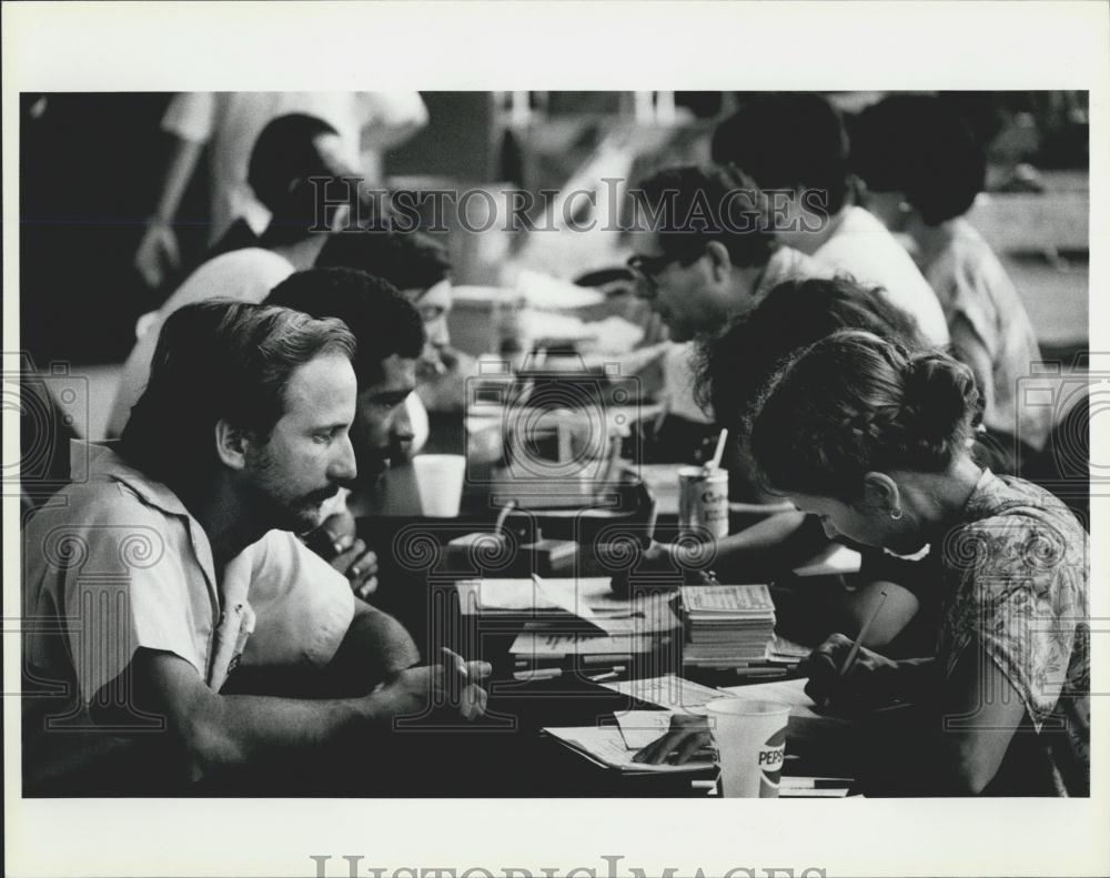 Press Photo Cuban Refugees Answer Questions For Immigration Workers - Historic Images