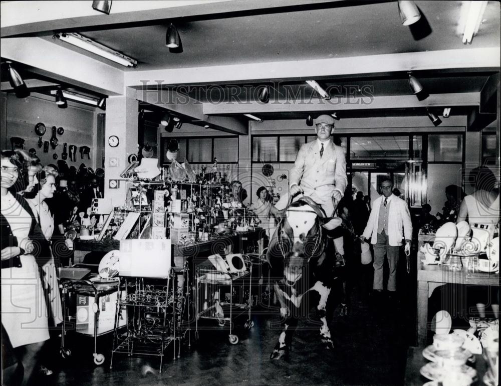 Press Photo Man Riding Cow - Historic Images