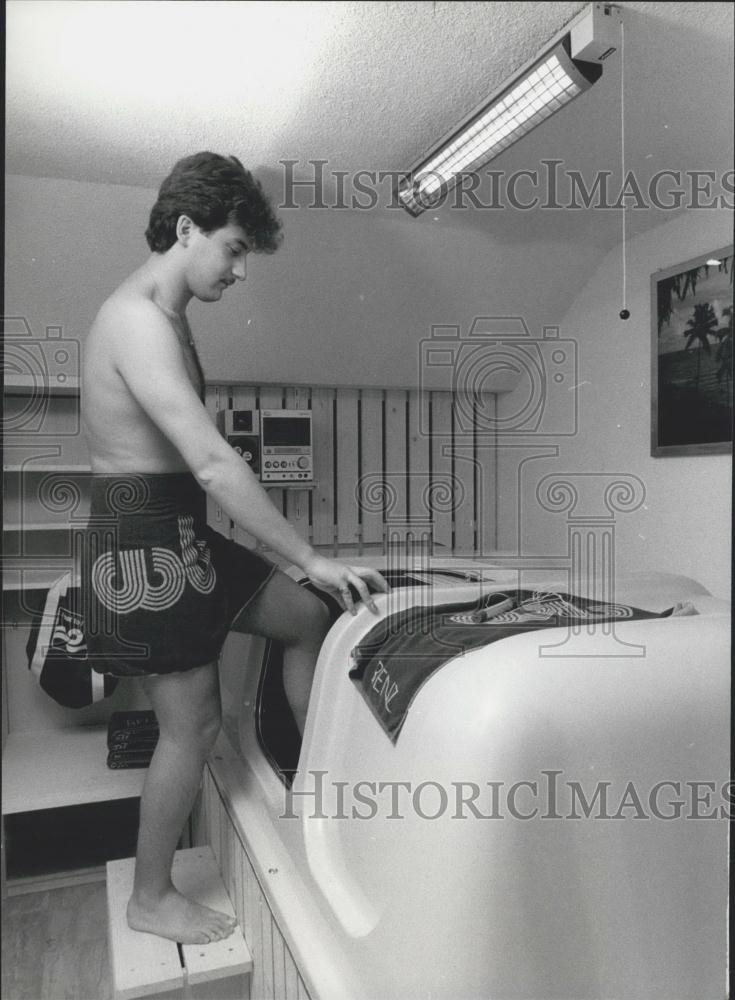 Press Photo Courageous Boy Tries Out New Relaxation Device - Historic Images