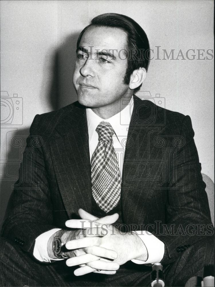 Press Photo Greek Man Clasping Hands Seated - Historic Images