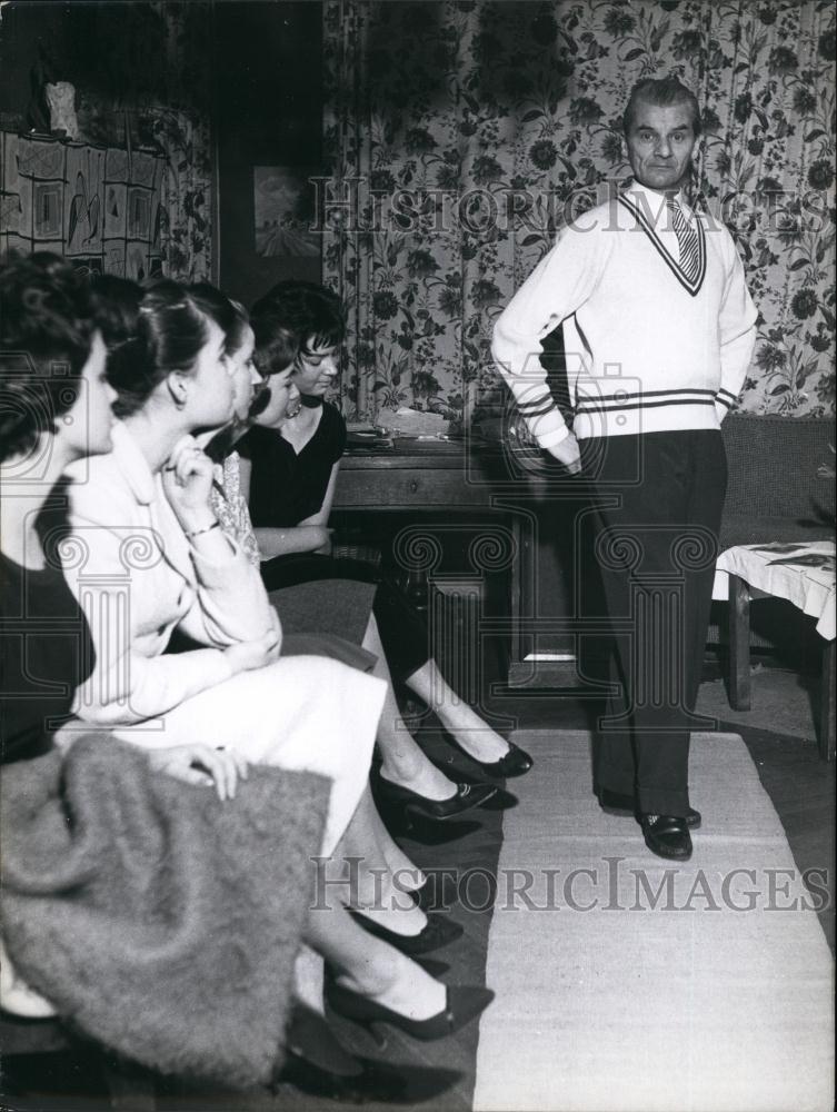 Press Photo Man Poses in Front of Group of Women - Historic Images