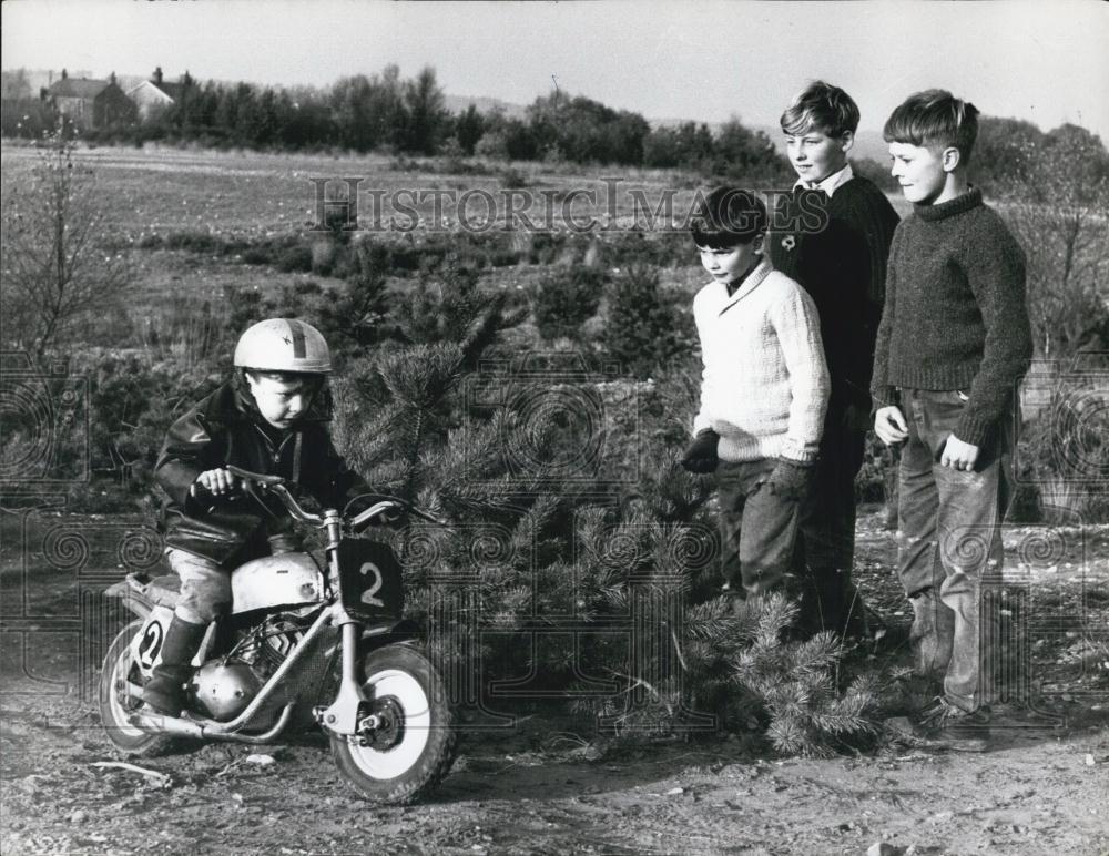 Press Photo Little boy riding on a mini motor Cycle - Historic Images