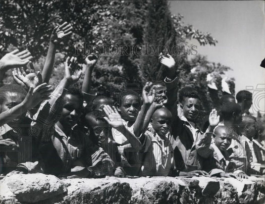 Press Photo crowd of Ethiopian boys wave at the Duke and Duchess of Glouchester' - Historic Images