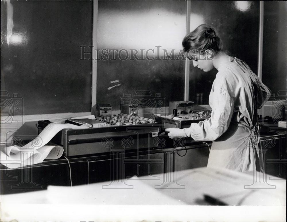 Press Photo laboratory technician checks some of the apparatus From Sex Scene - Historic Images