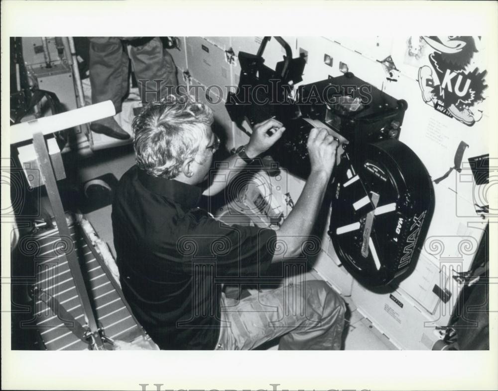 Press Photo A Man Operates IMAX Machinery - Historic Images