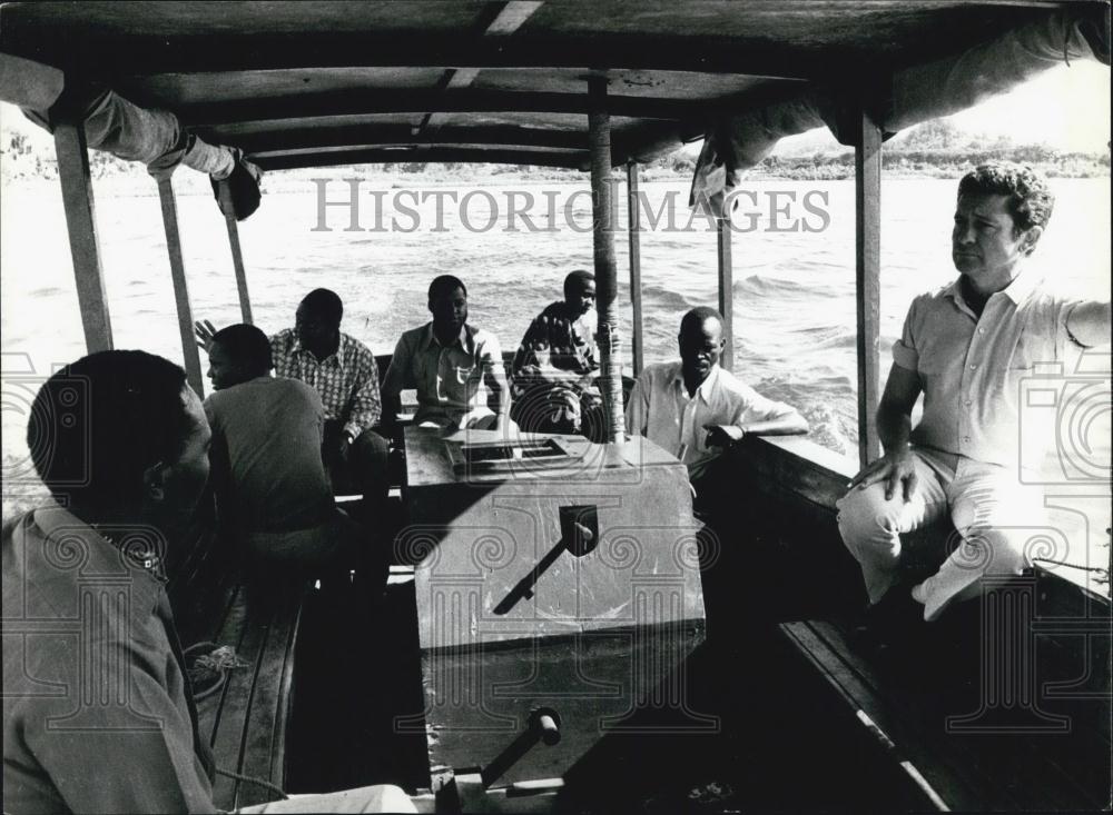 Press Photo Men Riding In Boat Over Waters In Istanbul Turkey - Historic Images