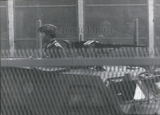 1967 Press Photo East Berlin Soldier Sits Atop Tank At Border - Historic Images